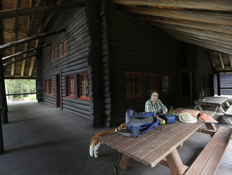 Cynthia Taylor,of Watertown, Mass., has lunch on the porch at Camp Santanoni.