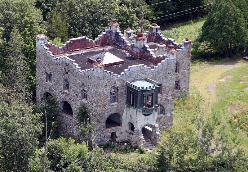 In this photo taken Wednesday Aug. 7, 2013 Kimball Castle is seen in Gilford, N.H. It was built in the late 1890s for Benjamin Ames Kimball, who was president of the Boston-Montreal Railroad. The decrepit castle with commanding views of the Lake Winnipesaukee is under the threat of a wrecking ball in its near future. (AP Photo/Jim Cole)