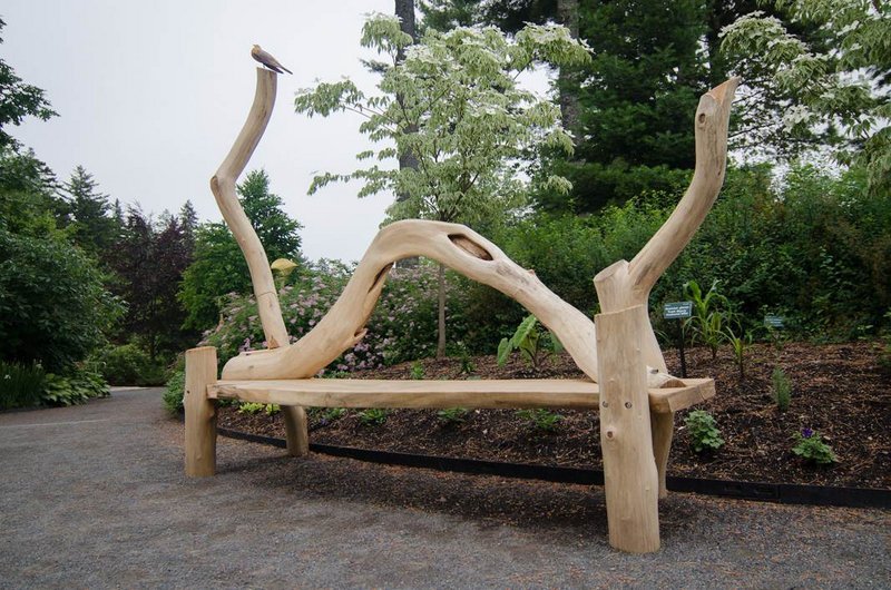At Coastal Maine Botanical Gardens in Boothbay: “Black Locust Bench with Robin” by Ray Carbone.