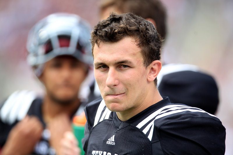 Johnny Manziel’s amateur status could be at risk from being paid to sign autographs, and if so, the people who enabled him could be sued by Texas A&M.