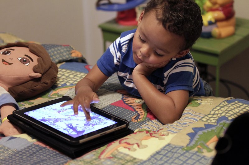 Playing with an iPad is more interactive than watching TV, and child development experts are divided over whether that makes mobile technology any better for young children.