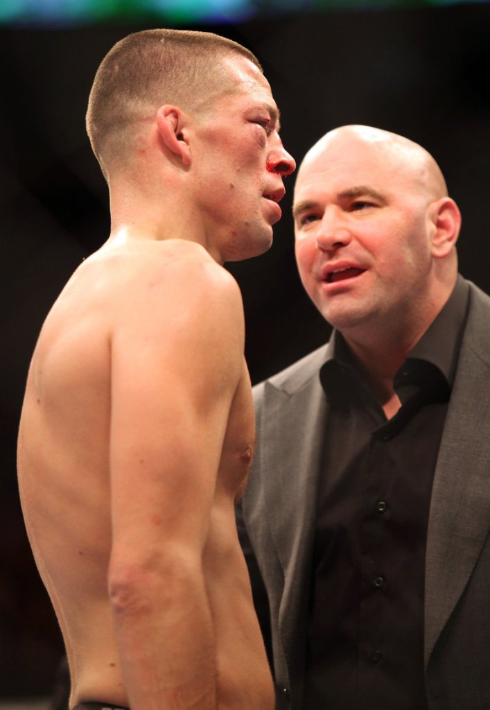 Dana White, right, has overseen the rise of professional mixed martial arts from his upbringing in Maine to his role as UFC president.