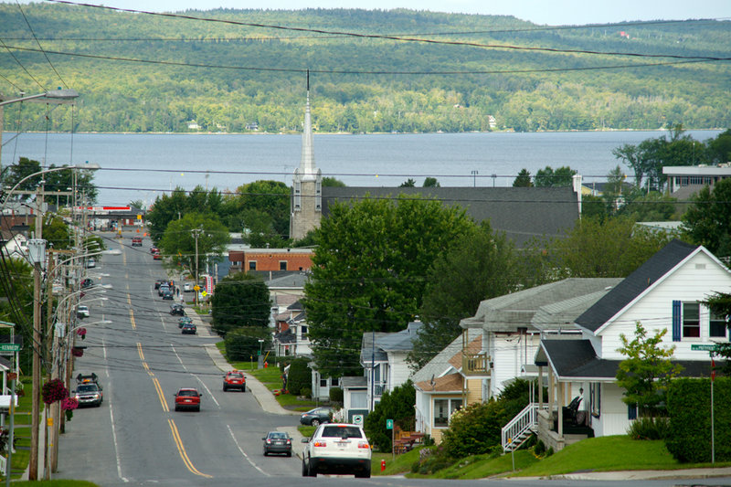 Just under 6,000 people live in Lac-Megantic. The downtown is situated on the shore of Lake Megantic at the bottom of a long hill. The railroad passes through the downtown along the shore. The lake itself is a depression in the Appalachian Mountains.