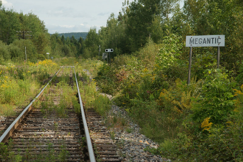 A sign alongside the Montreal, Maine & Atlantic Railway tells engineers they have arrived in Lac-Megantic, originally called Megantic, a town in Quebec about 22 miles from the Maine border.