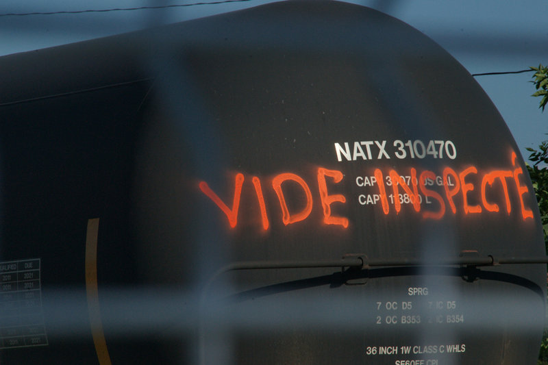 Cleanup crews have painted “empty inspected” on a tanker car in the “red zone” at Lac-Megantic, the epicenter of the July 6 train derailment that killed 47 people. Authorities say tanker cars carrying oil exploded when the train derailed.