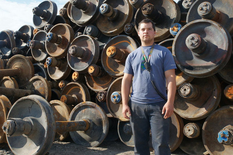 Francis Cliche, 28, a scrap dealer in the town of Frontenac, stands in front of wheels taken from tanker cars that were wrecked in the July 6 accident in Lac-Megantic. Cliche said his children’s baby sitter was killed in the disaster.