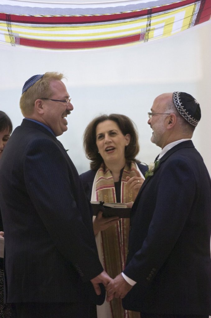 Rabbi Mona Alfi marries Dan Hoody, left, and Dave Felderstein at the Congregation B'nai Israel in Sacramento, Calif., during a brief window in 2008 when gay marriage was legal in the state – as it is once again.