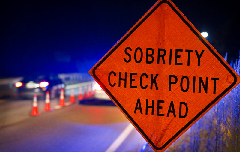 A sign warns motorists of a sobriety checkpoint on Route 1 in Brunswick.