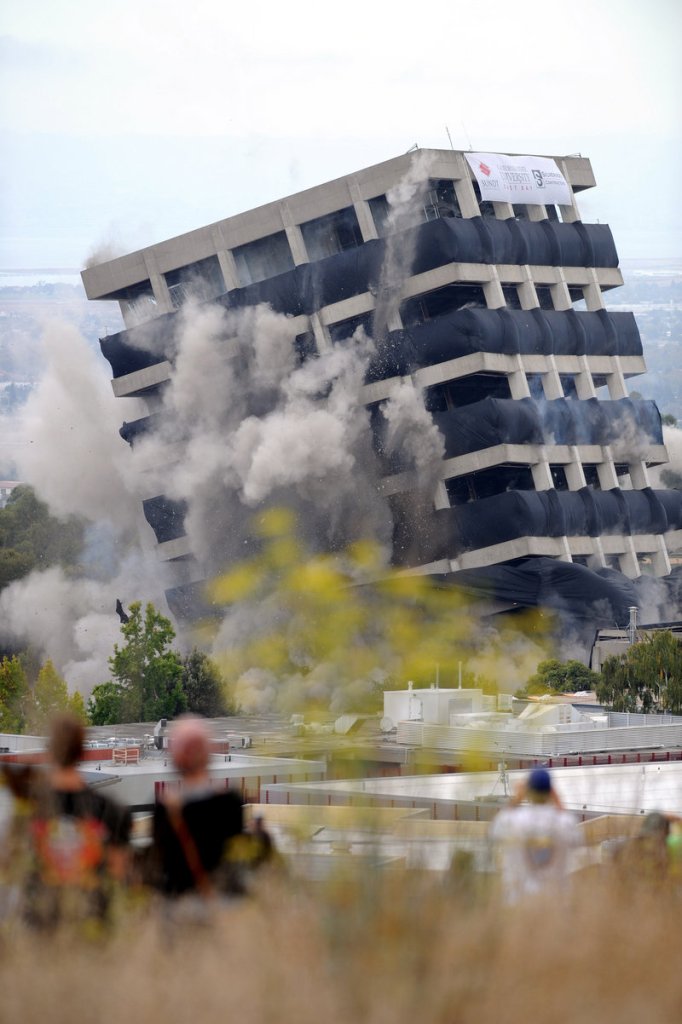 Declared seismically unsafe two years ago, Warren Hall is imploded in a data-gathering experiment on the campus of Cal State East Bay in Hayward, Calif., on Saturday.