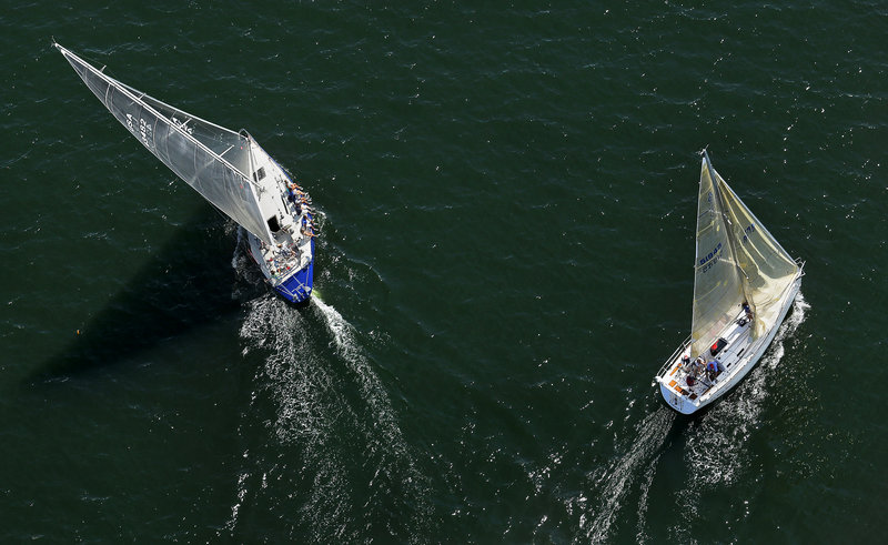 Two sailboats take different paths while competing in the MS Regatta in Casco Bay on Saturday.