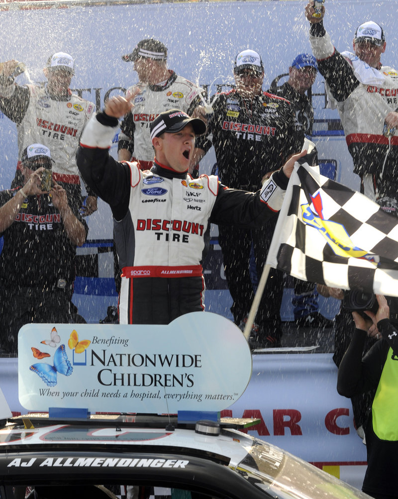 AJ Allmendinger celebrates his victory Saturday in the NASCAR Nationwide Series race at Mid-Ohio Sports Car Course in Lexington, Ohio.