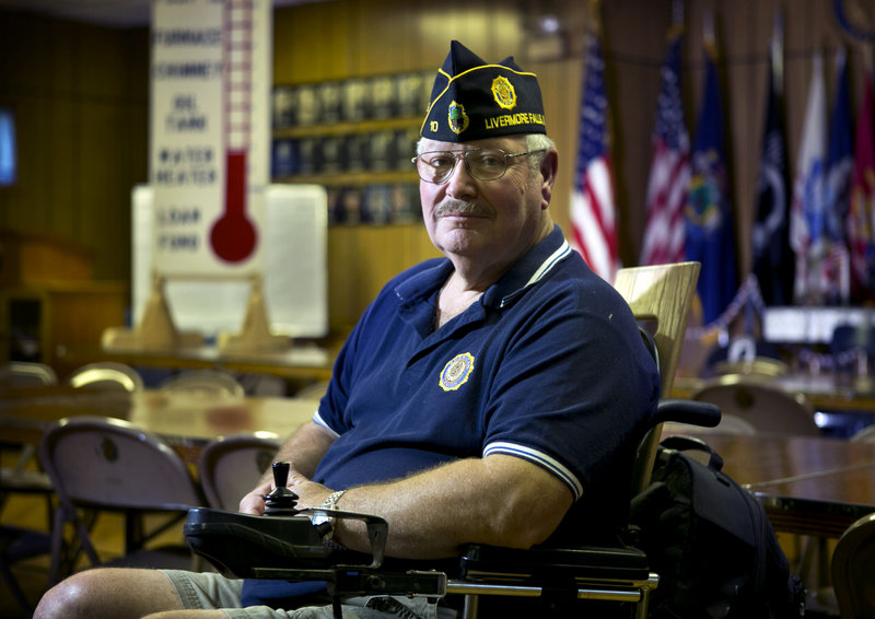 Don Simoneau, executive director of American Legion Post 10 in Livermore Falls, sits in his wheelchair in the hall that once drew large numbers of bingo players.