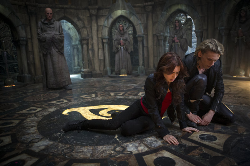 Lily Collins and Jamie Campbell Bower in the new action-adventure film “The Mortal Instruments: City of Bones.”