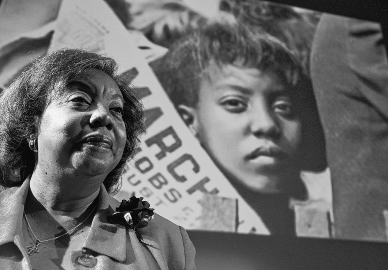 Edith Lee-Payne, a community activist in Detroit, stands in front of an image of herself at age 12 taken at the March on Washington in 1963. “Everyone was hanging on Dr. King’s every word,” she says. “When you heard him, you felt it was going to be all right.”
