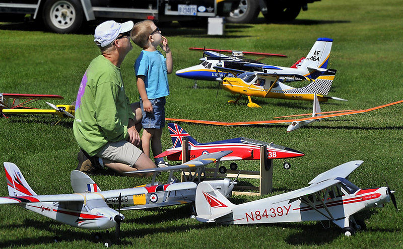 New Gloucester’s Jim Washburn and his son enjoy last week’s Fun Fly in New Gloucester, where model plane enthusiasts gathered from far and wide.