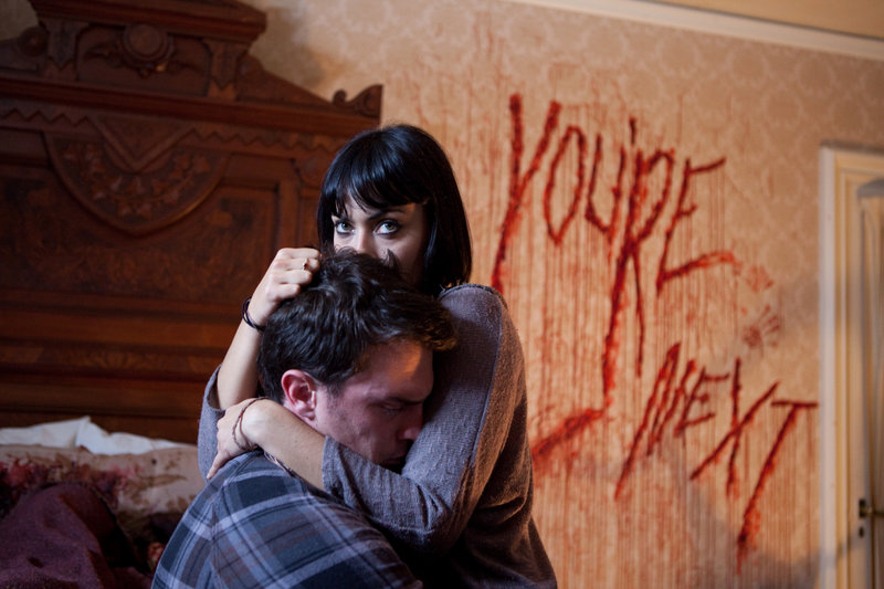 Nicholas Tucci and Wendy Glenn in a scene from “You’re Next.”