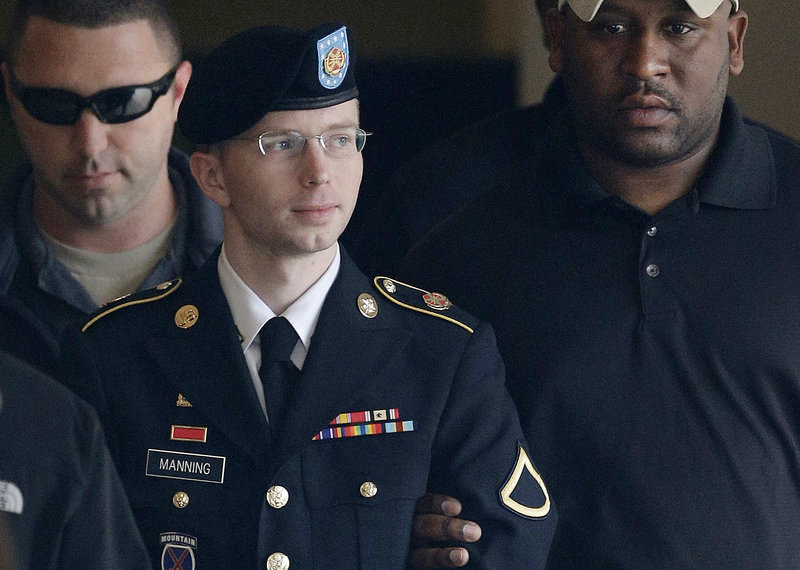 Army Pfc. Bradley Manning is escorted to a vehicle outside a courthouse in Fort Meade, Md., after a hearing in his court martial. Manning said Thursday that he wants to live as a woman named Chelsea.