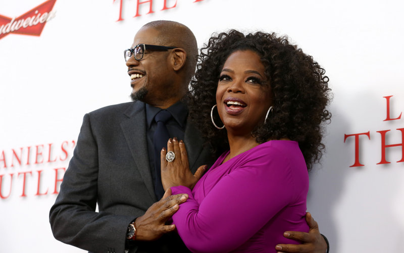 Oprah Winfrey, right, shares a moment with Forest Whitaker at the premiere of “Lee Daniels’ The Butler.”