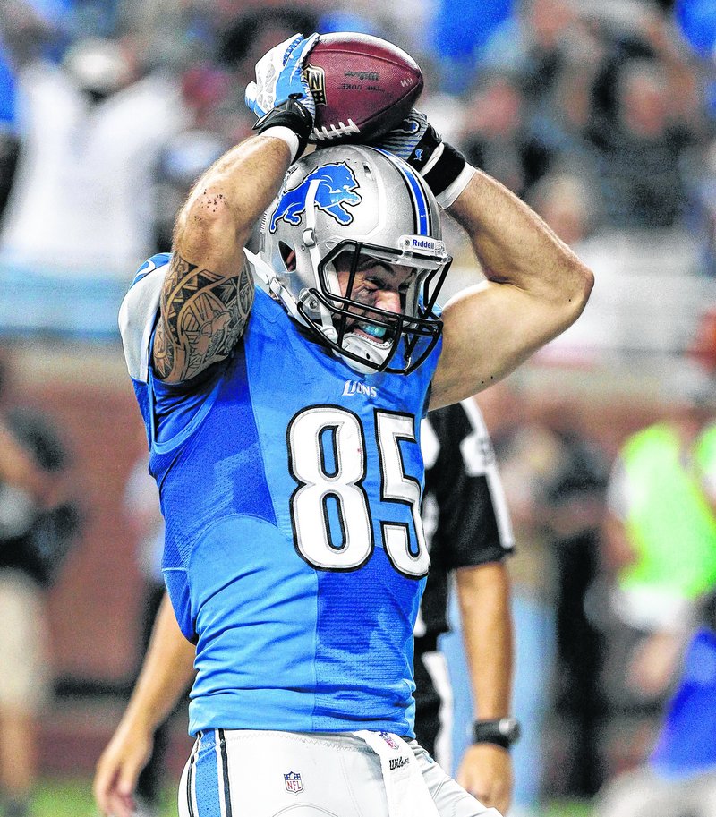 Detroit tight end Tony Scheffler celebrates after catching a 9-yard touchdown pass from quarterback Matthew Stafford during the second quarter of the Lions’ rout over the Patriots.