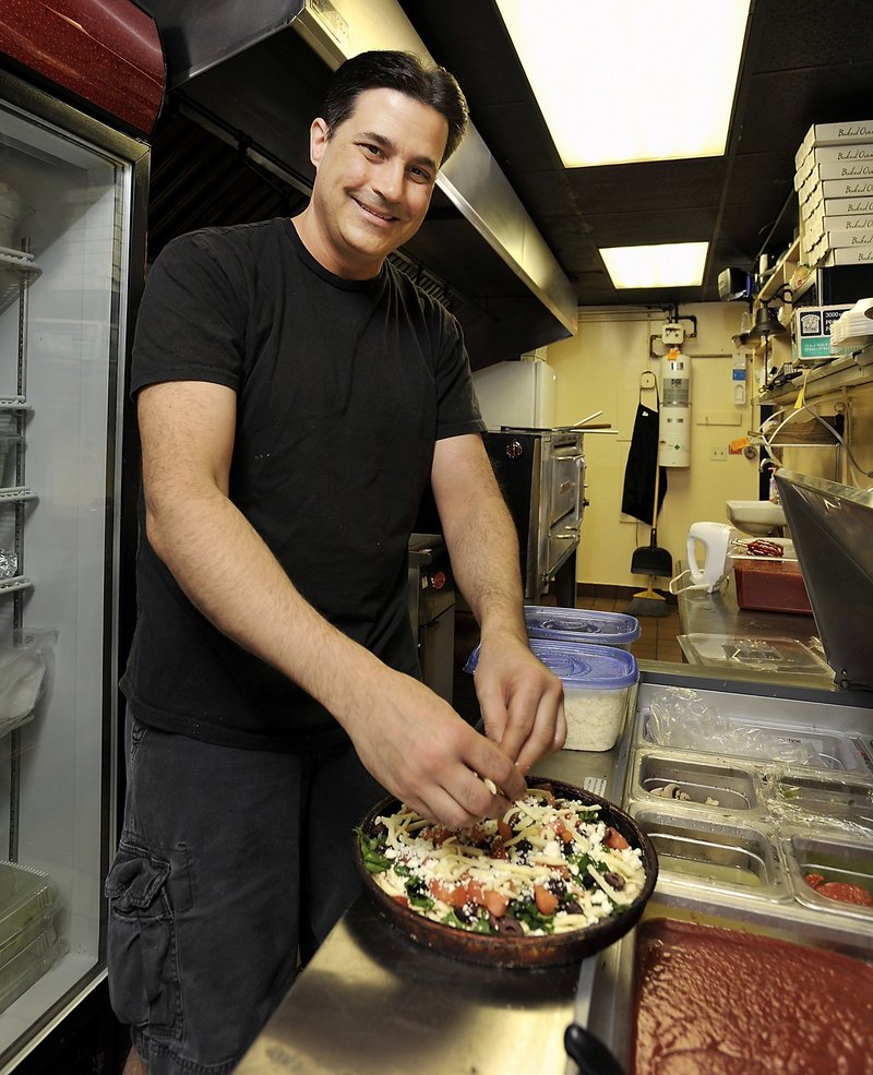 Ed Horvath puts together a specialty pie at You Wanna Pizza Me.