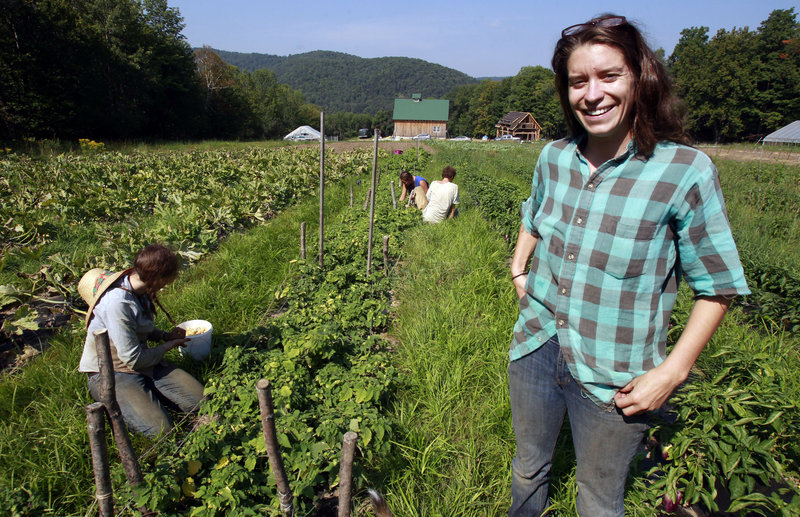 Kara Fitzgerald stands at her new farm location in Shrewsbury, Vt. Two years after Irene washed away 10 acres of summer crops and topsoil, Evening Song Farm is back selling produce, thanks to borrowed money and land.