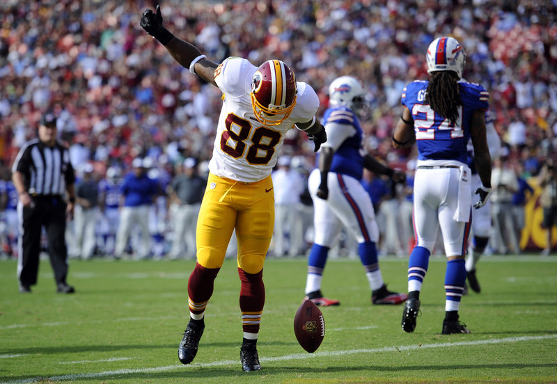 Redskins receiver Pierre Garcon celebrates after catching a touchdown pass Saturday, starting Washington on its way to a 30-7 win over the Bills.