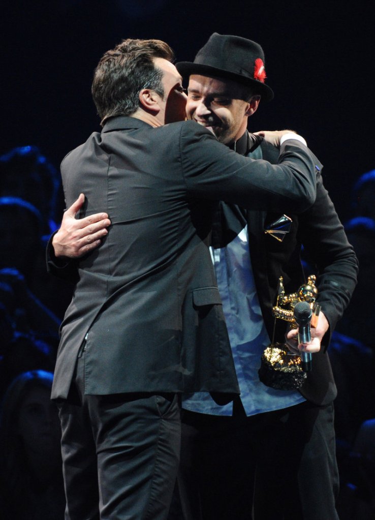 Justin Timberlake accepts the Michael Jackson Video Vanguard Award from Jimmy Fallon, left, at the MTV Video Music Awards Sunday night.