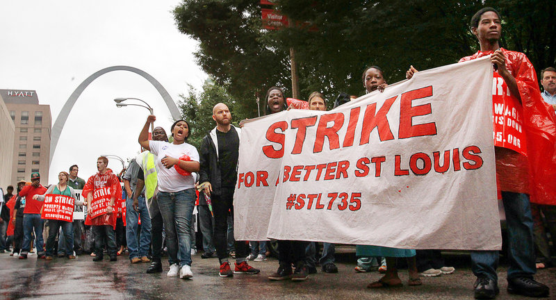 Protesters march through downtown St. Louis to demand a higher minimum wage last month. The push to increase the minimum wage has brought attention to “McJobs,” which are known for their low pay and limited prospects.