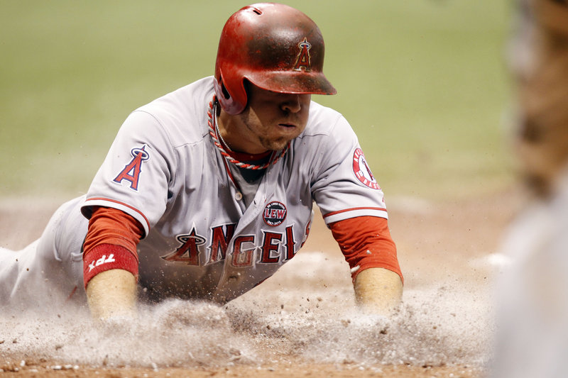 J.B. Shuck of the Los Angeles Angels slides home to score against Tampa Bay in the sixth inning of a 2-0 Angels win Thursday.