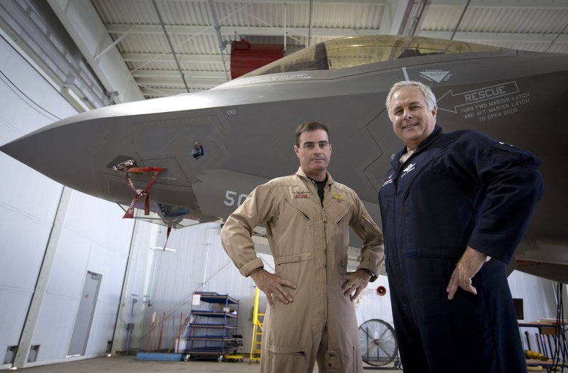 Lockheed Martin test pilots Bill Gigliotti, left, and Alan Norman appear on the line with an F-35A being made ready for delivery to Eglin Air Force Base in Florida earlier this month.