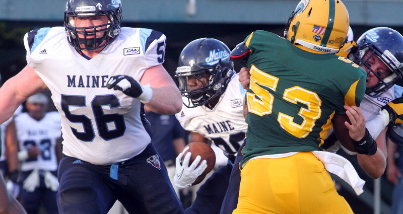 Maine running back Rickey Stevens follows the block of Daniel Carriker to score the game’s first touchdown – a 2-yard run in the second quarter.