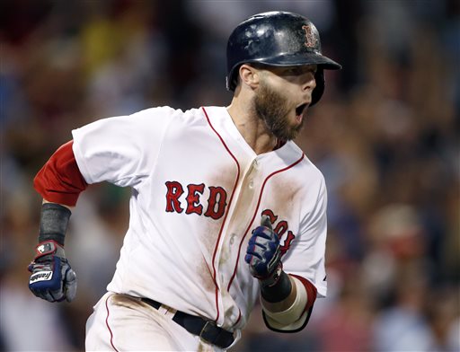 Dustin Pedroia rounds first base after hitting a two-run homer against the Seattle Mariners during the seventh inning at Fenway Park ion Wednesday.