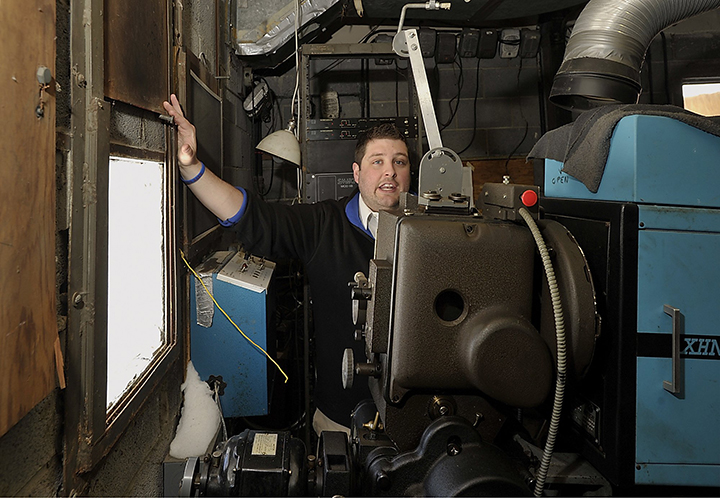 Ry Russell, who runs the Saco Drive-In, stands near one of the windows that the projector projects the movies through in this Tuesday, February 12, 2013. The Saco Drive-In won a national contest and will receive a new digital projection system, which will allow it to continue to operate next year.