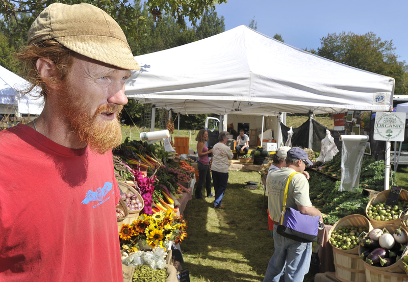 Ian Jerolmack of Stonecipher Farm in Bowdoinham talks about the benefits of organic farming during the opening day of the Common Ground Fair in Unity on Friday.
