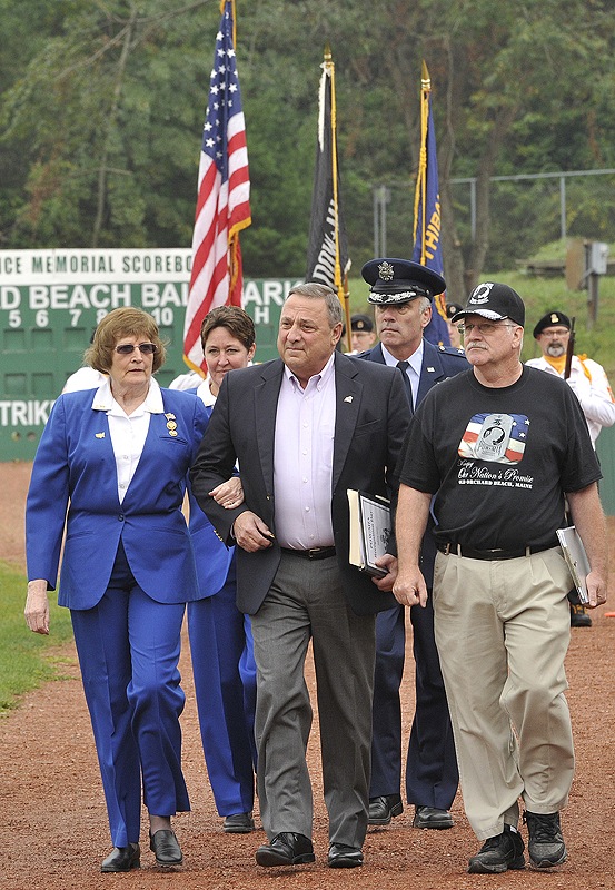 Gov. Paul LePage is escorted onto the field at The Ballpark in Old Orchard Beach to participate in the POW/MIA Recognition Weekend event Saturday.