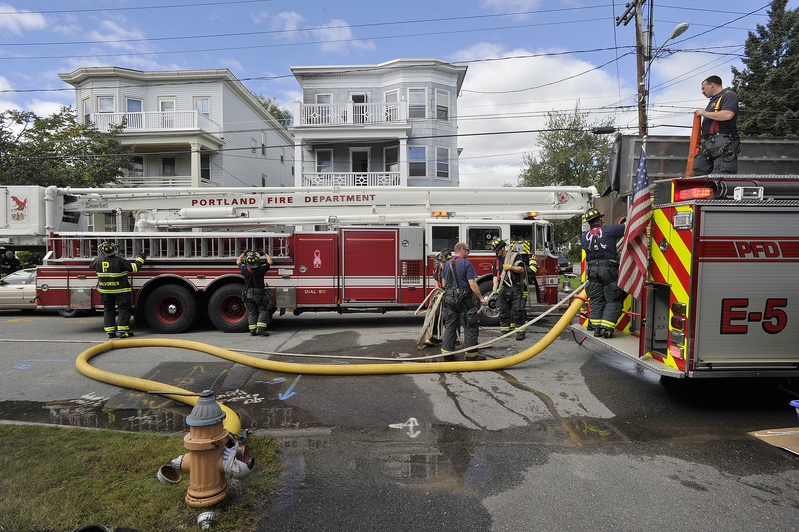 Portland firefighters quickly extinguished a fire in a three-story apartment building on Whitney Avenue in Portland on Thursday.