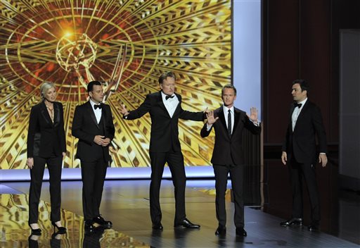 Jane Lynch, from left, Jimmy Kimmel, Conan O' Brien, Neil Patrick Harris, and Jimmy Fallon speak on stage Sunday at the 65th Primetime Emmy Awards at Nokia Theatre in Los Angeles.