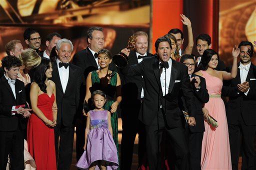 Steven Levitan, foreground, and the cast and crew of "Modern Family" accept the award for outstanding comedy series at the 65th Primetime Emmy Awards at Nokia Theatre on Sunday.