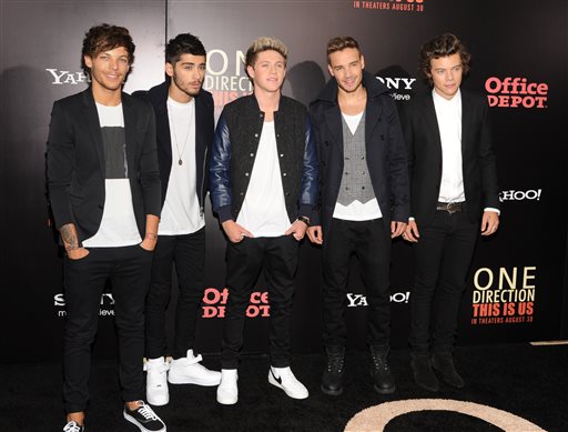 British boy band One Direction, from left, Louis Tomlinson, Zayn Malik, Niall Horan, Liam Payne and Harry Styles attend the premiere of "One Direction: This Is Us" at the Ziegfeld Theatre on Monday, Aug. 26, 2013 in New York. Band Member,Film Premiere,Full Length,Group Portrait,Movie Premiere,One Direction,Small Group of People,Smart Casual