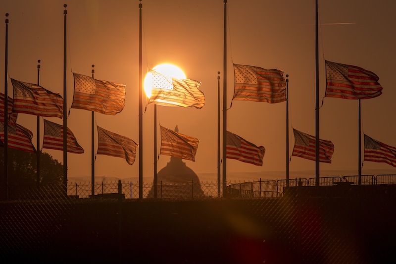 The American flags surrounding the Washington Monument fly at half-staff as ordered by President Barack Obama following the deadly shooting Monday at the Washington Navy Yard, Tuesday morning, Sept. 17, 2013, in Washington. (AP Photo/J. Scott Applewhite)
