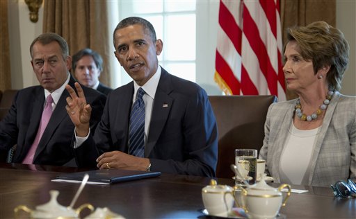 President Barack Obama, flanked by House Speaker John Boehner of Ohio and House Minority Leader Nancy Pelosi of California, speaks to media in the Cabinet Room of the White House on Tuesday, before a meeting to discuss the situation in Syria.