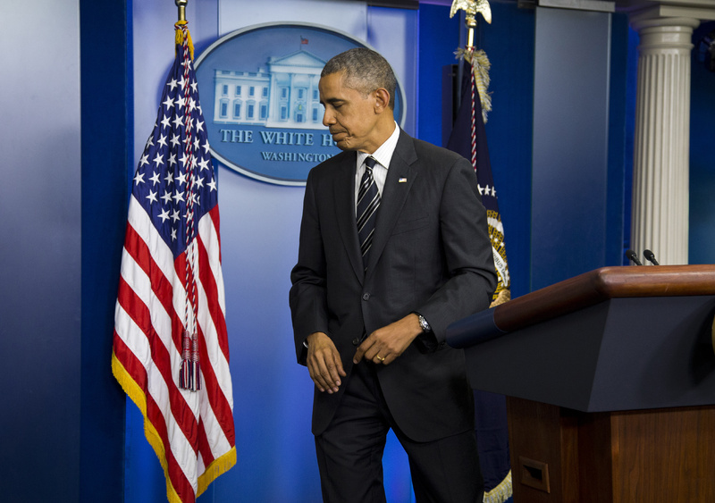 President Barack Obama leaves the podium after making a statement regarding the budget fight in Congress and foreign policy challenges on Friday at the White House in Washington.
