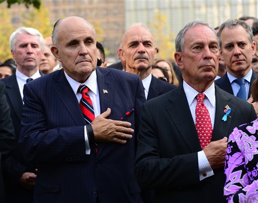 Former New York Mayor Rudolph Giuliani, foreground left, and Mayor Michael Bloomberg, right, attend ceremonies at the 9/11 Memorial marking the 12th Anniversary of the attacks on the World Trade Center, in New York, on Wednesday.