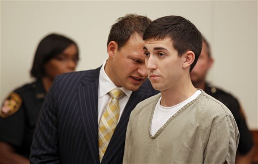 Attorney Martin Midian, left, talks with Matthew Cordle in the Franklin County Common Pleas Court in Columbus, Ohio, on Wednesday. Cordle, who pleaded guilty to aggravated vehicular homicide, faces two to 8½ years in prison at sentencing, which was set for Oct. 10, and will also lose driving privileges for life.