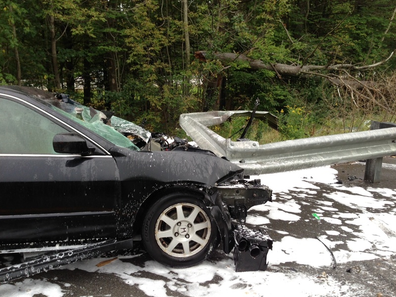 A Brunswick man escaped serious injury Tuesday afternoon when his car slammed into a guardrail along Interstate 295 in Bowdoinham and caught fire.
