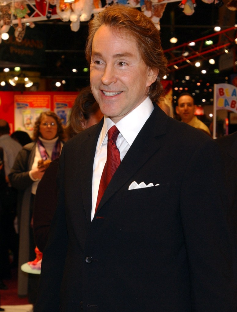 In this Feb 16, 2003 file photo, Ty Warner, Beanie Baby creator arrives at the Toy Fair to sign "Decade," the10th anniversary baby bear in New York. Warner has been charged with federal tax evasion for allegedly failing to report income he earned in a secret offshore financial account. As prosecutors in Chicago announced the legal action against Warner on Wednesday, Sept. 18, 2013, his attorney issued a statement saying the 69-year-old would plead guilty and pay a penalty of more than $53 million. (AP Photo/Louis Lanzano)