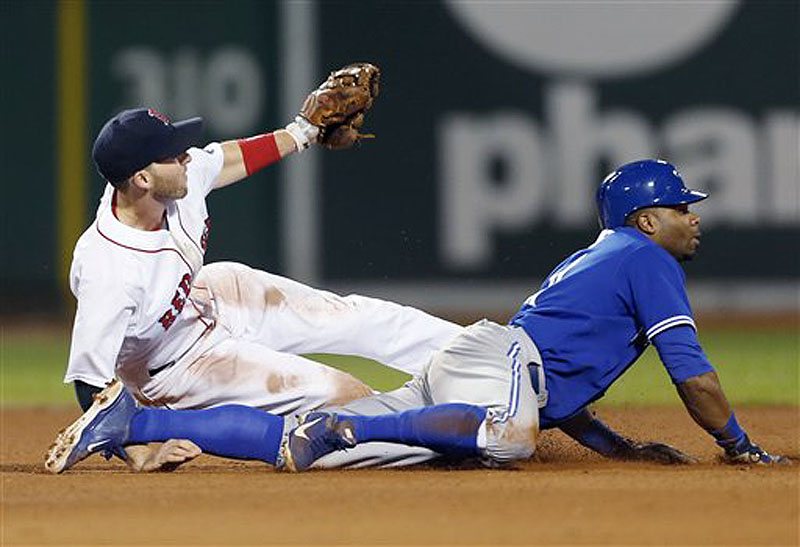 Boston's Stephen Drew and Toronto's Rajai Davis look for the call after Davis was caught stealing second base in the sixth inning Saturday at Fenway Park.