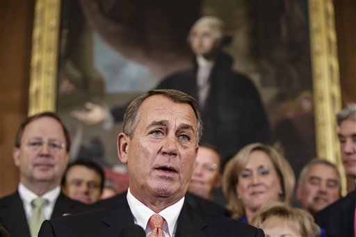 Speaker of the House John Boehner, R-Ohio, and Republican members of the House of Representatives rally at the Capitol on Friday after passing a bill that would prevent a government shutdown while crippling the Affordable Care Act.