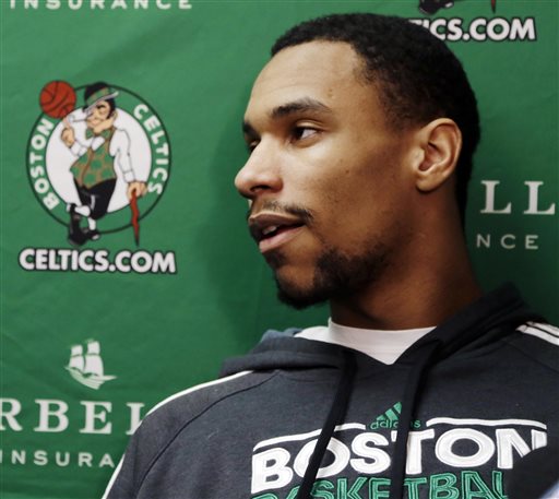 In this February 2013 file photo, Boston Celtics forward Jared Sullinger speaks to reporters about his season-ending back surgery. Sullinger, 21, has been accused of assault in a domestic-violence incident involving his girlfriend.