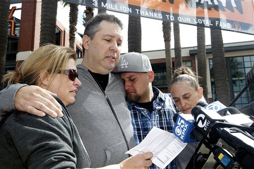 From left, Jill Haro, aunt; Robert Preece, father; Robert Preece Jr., brother; and Diana Denver, mother, of Los Angeles Dodgers fan Jonathan Denver, make a public plea Sunday before the Giants' baseball game in San Francisco for witnesses to the fatal stabbing Wednesday of Jonathan Denver. Jonathan Denver, 24, was stabbed Wednesday during a melee following a game between the Giants and the Los Angeles Dodgers. AT&T Park